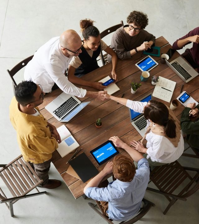 pexels-photo-3183172-3183172 Overhead shot of a diverse team collaborating in a modern office meeting.